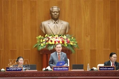 Politburo member and President of Laos’ ninth National Assembly Xaysomphon Phomvihane delivers the opening address at the session. (Photo: VNA)