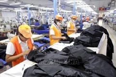 Workers at the Shirt and Suit Factory of Garment Corporation 10 in Long Bien district, Hanoi. (Photo: VNA)