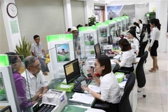 Market-wide revenue and post-tax profit rose by approximately 20.1% and 50.8% year-on-year respectively. (Photo: VNA)