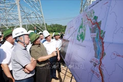 Prime Minister Pham Minh Chinh (second from left) inspects the construction process of 500kV Lao Cai – Vinh Yen transmission line project (Photo: VNA)
