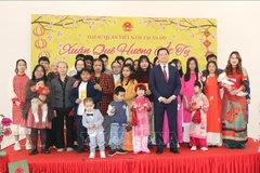 Participants pose for a group photo at the “Xuan Que Huong” (Homeland Spring) programme in New Delhi, India on January 19, 2025). 