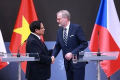 Prime Minister Pham Minh Chinh and his Czech counterpart Petr Fiala hold a joint press conference to announce the outcomes of their talks in Prague on January 20. (Photo: VNA)