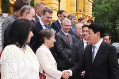 State President Luong Cuong (right) welcomes EU diplomats at the meeting in Hanoi on June 9. (Photo: VNA)