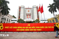 Banner welcoming the 14th National Congress of the Communist Party of Vietnam displayed in front of the Hanoi People’s Committee headquarters. (Photo: VNA)