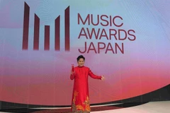 Tung Duong wears ao dai to receive the International Special Award at MAJ 2025 in Kyoto, Japan. (Photos courtesy of MAJ)