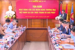 An overview of the seminar to look into operations of Vietnamese banks in Laos. (Photo: VNA)