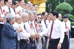State President Luong Cuong meets with veteran and outstanding journalists on June 20. (Photo: VNA)