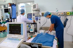 Doctors at Thu Duc General Hospital monitor and care for a patient following cardiac intervention. (Photo courtesy of Thu Duc General Hospital)