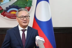 Lao Foreign Minister Thongsavanh Phomvihane shares about the role of Vietnam's revolutionary press. (Photo: VNA)
