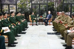 The meeting between First Secretary of the Communist Party of Cuba Central Committee and President of Cuba Miguel Díaz-Canel Bermúdez and the high-ranking delegation from the Vietnam People’s Army (VPA), led by General Nguyen Tan Cuong, Chief of the VPA’s General Staff and Deputy Minister of National Defence. (Photo: VNA)