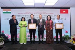 Two collectives and six individuals from the VIFA are presented certificates of merit from the Chairperson of the HCM City People's Committee for their outstanding achievements in people-to-people diplomacy. (Photo: VNA)