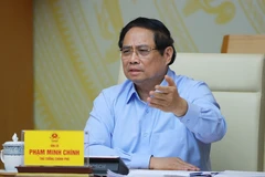 Prime Minister Pham Minh Chinh addressing the conference (Photo: VNA)