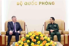 Minister of National Defence General Phan Van Giang (R) hosts Secretary of State at the Ministry of National Defence of Poland Pawel Bejda in Hanoi on March 24. (Photo: VNA)