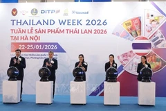 Delegates perform the opening ceremony. (Photo: VNA)