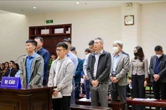 Defendants in the case involving Thuan An Group and several related units and localities at the appellate court in Hanoi on December 18 (Photo: VNA)