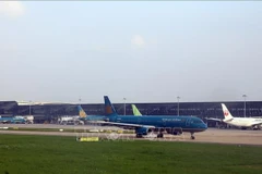 At Noi Bai international airport (Photo: VNA)