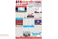 The article by Khamphan Pheuyavong, head of the Lao People’s Revolutionary Party (LPRP) Central Committee’s Propaganda and Training Commission and Chairman of the LPRP Central Committee's Theory Council, published in the Pasaxon newspaper (Photo: VNA)