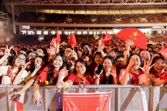 Enthusiastic audience members at a live music show in Hanoi. (Photo: VNA)