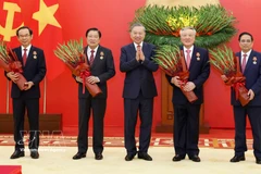 Party General Secretary To Lam presents the Military Exploit Order to high-ranking officials (Photo: VNA)