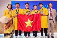Four Vietnamese students (centre) win gold medals at the 57th International Chemistry Olympiad (IChO), held in Dubai, the United Arab Emirates (UAE), from July 5 to 14. (Photo: Ministry of Education and Training)