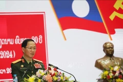 Lao Minister of National Defence Sen. Lieut. Gen Khamlieng Outhakaysone speaks at the meeting. (Photo: VNA)