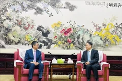 Vietnamese Ambassador to China Pham Thanh Binh (L) and President of the Chinese People’s Association for Friendship with Foreign Countries Yang Wanming. (Photo: VNA)