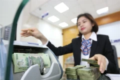 The bad debt ratio continues to inch down from 2.04% in Q2 2025 to 2.01% in Q3 2025. (Photo: VNA)