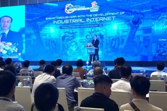 Nguyen Truong Giang, Deputy Director of the Vietnam Internet Network Information Centre, speaks at the event. (Photo: nhandan.vn)