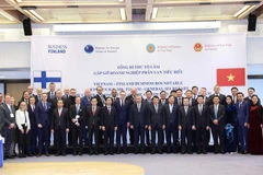 Party General Secretary To Lam (ninth from right, first row) and representatives of leading Finnish enterprises. (Photo: VNA)