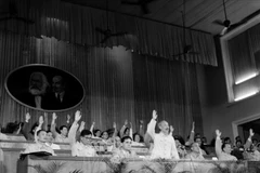 President Ho Chi Minh and delegates vote to approve documents at the 3rd National Party Congress September, 1960. (File photo: VNA)