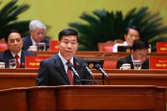 Member of the Party Central Committee, Deputy Minister of Foreign Affairs Nguyen Manh Cuong delivers a presentation at the 14th National Party Congress. (Photo: VNA)