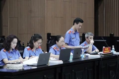 A representative of the Hanoi People’s Procuracy delivers recommended sentences for defendants at the court. (Photo: VNA)