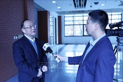 Professor Jin Canrong grants an interview to Vietnam News Agency correspondents in Beijing (Photo: VNA)