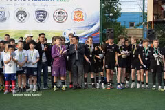 Players participate in the friendly football tournament. (Photo: VNA)
