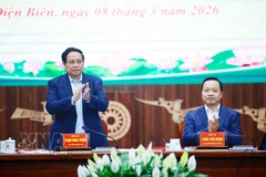 Prime Minister Pham Minh Chinh (L) at the working session with leaders of the Dien Bien provincial People’s Committee on March 8. (Photo: VNA)