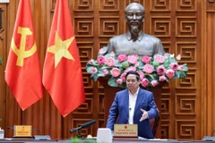 Prime Minister Pham Minh Chinh speaks at the meeting (Photo: VNA)