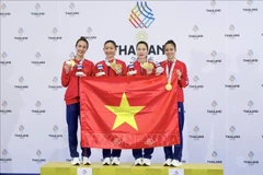 Athletes Hoang Thi My Tam, Dinh Thi Huong, Nguyen Thi Dieu Ly and Nguyen Thi Thu deliver an outstanding performance at SEA Games 33, defeating hosts Thailand 2-0 to clinch the gold medal on December 14. (Photo: VNA)