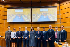 Representatives from Vietnam, UNODC, and the European Union Delegation to the UN in Vienna pose for a photo. (Photo: nhandan.vn)