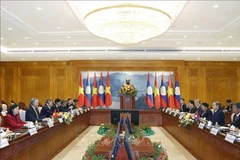 At the meeting between Party General Secretary To Lam and President of the Lao National Assembly Saysomphone Phomvihane (Photo: VNA)