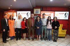 Participants pose for a group photo at the special film screening commemorating the 135th birth anniversary of President Ho Chi Minh on May 19 in Greece. (Photo: VNA)