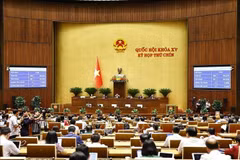 The 15th National Assembly passes the Law on Teachers, with 451 out of 460 NA deputies present at the 9th session on June 16, or 94.35% of the total legislators, voted in favour. (Photo: VNA)