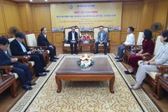 During the working session between President of the Lao Journalists’ Association (LJA) Savanhkhone Razmountry and Editor-in-Chief of Nhan Dan (People) newspaper and VJA Chairman Le Quoc Minh in Hanoi on December 8, 2025 (Photo: VNA)