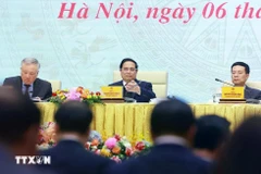 Prime Minister Pham Minh Chinh chairs a meeting to review the activities of the National Committee for Digital Transformation and Project 06. (Photo: VNA)