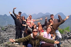 Foreign tourists excited by Ha Giang travel experiences. (Photo: VNA)