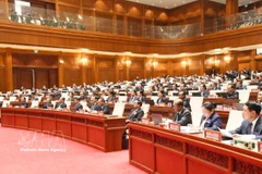 Deputies attend the first session of the 10th National Assembly of Laos. (Photo: VNA)