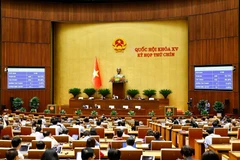 The draft law amending and supplementing a number of articles of the Law on Standards and Technical Regulations is approved with 432 out of 448 participating deputies voting in favour (Photo: VNA)