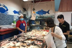 A woman goes to the supermarket in HCM City. (Photo: VNA)