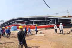 Rescuers approach the collapsed building at the Bang Phli Metropolitan Electricity Authority training centre in Bang Sao Thong district in Samut Prakan province on Monday. (Photo: Fire and Rescue Thailand)