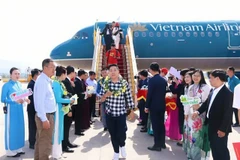 Passengers of the first direct flight connecting HCM City and Dien Bien are welcomed at Dien Bien airport on December 24. (Photo: VNA)