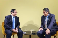 Prime Minister Pham Minh Chinh (L) meets with President of Palau Surangel Whipps Jr. in Nice, France on June 9 (Photo: VNA)